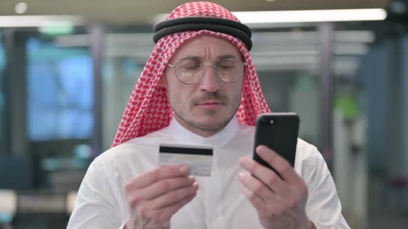 Middle Aged Arab Man with Successful Online Shopping on Smartphone