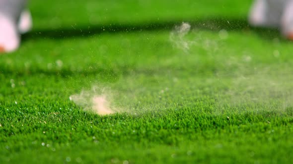 Super Slow Motion Shot of Perfect Golf Stroke With Splashing Water and Powder at 1000 Fps