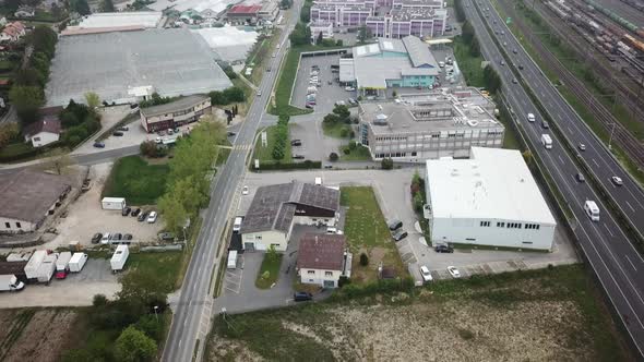 buildings in Morges, Switzerland, highway and cars nearby. drone aerial view