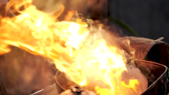 Slow Motion, Pour Food into Frying Pan Started Huge Flambe