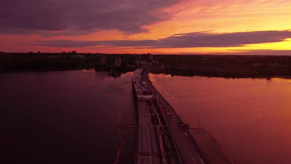 Aerial sunset over bridge under construction