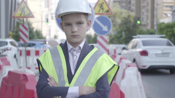 Portrait Cute Little Confidient Boy Wearing Business Suit and Safety Equipment and Constructor