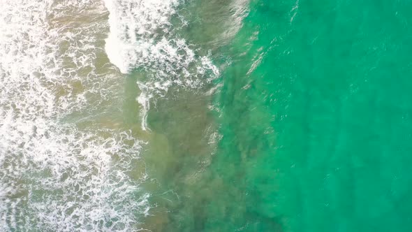 Aerial View of the Mediterranean Coast Waves Reach the Deserted Sandy Beach