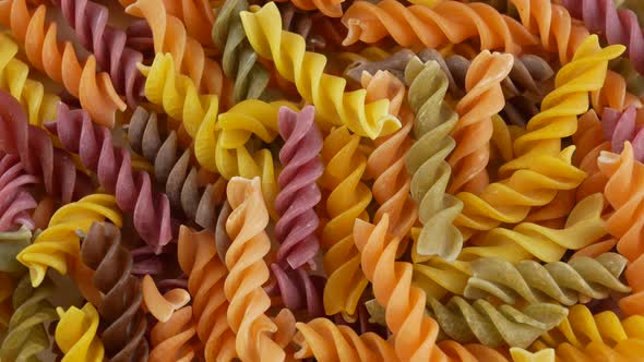 Colored italian fusilli raw pasta