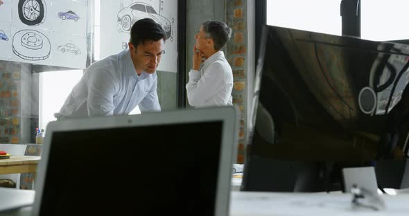 Car Designers Working at Desk 4k