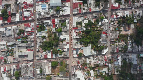 Aerial Birds Eye Overhead Top Down Panning View of Town with Streets and Blocks of Houses