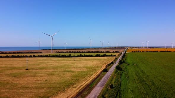 Windmills on the background of the sea.