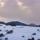 The Sun's Rays Shine Through the Dense Clouds on the Snowy Landscape - VideoHive Item for Sale