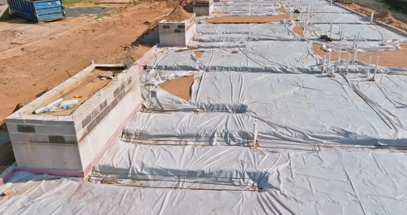 Plastic Vapor Barrier on Slab with Plumbing Pvc Pipes of Foundation