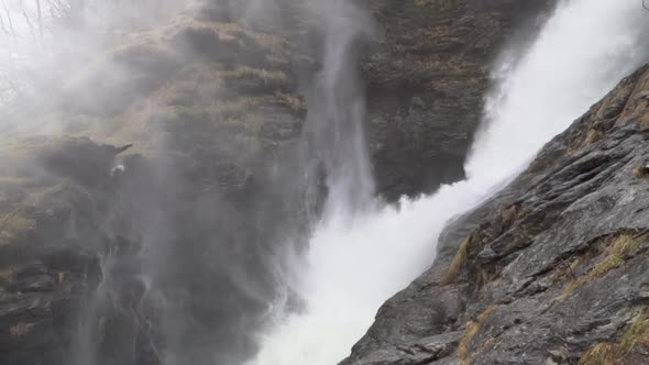 Panoramic of water flying from Svandalsfossen waterfall in Norway_slomo