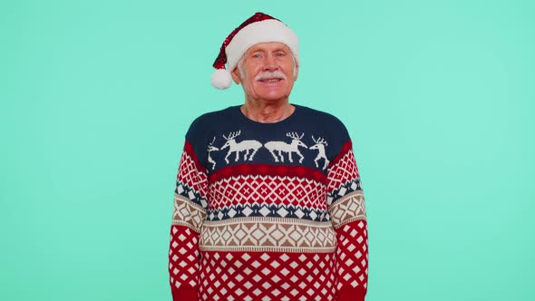 Grandfather Wears Red New Year Sweater with Deers Raises Thumbs Up Agrees with Something Good Like