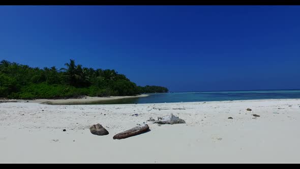 Aerial top down scenery of marine coastline beach voyage by transparent water with white sand backgr