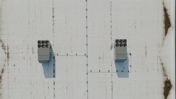 air conditioning units on the roof of a large commercial office building