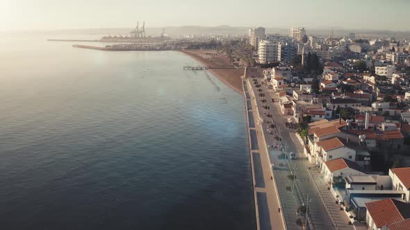 Sunset Panorama View of Seaside City of Larnaca Quay and Port Pier on Summer Vacation