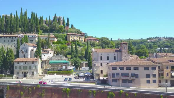 Panoramic aerial drone view of Verona,Italy.The drone turns and takes panorama of Castel San Pietro