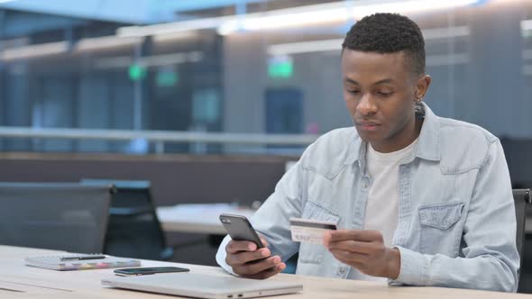 African Man with Unsuccessful Online Payment on Smartphone