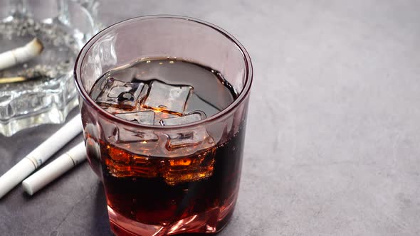 Alcohol Pills and Cigarette on Table