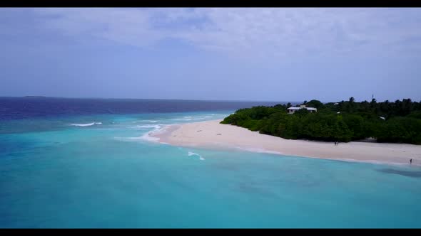 Aerial flying over scenery of tranquil tourist beach journey by blue sea and white sand background o
