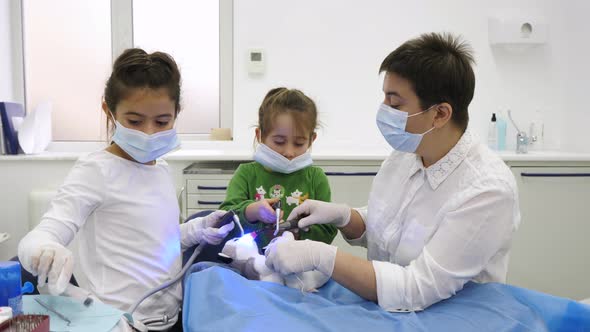 Girls playing dentist