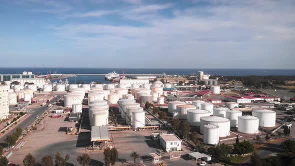 Big white gas tanks with on plant.