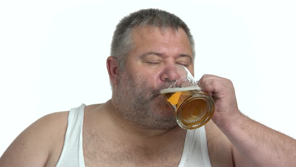 Portrait of Satisfied Fat Man Drinking Beer