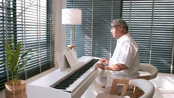 Middle-aged male playing the piano in his spare time. Wellness concept.