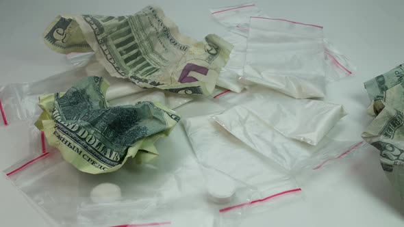 Cocaine And Crumpled Money Fall On The Table