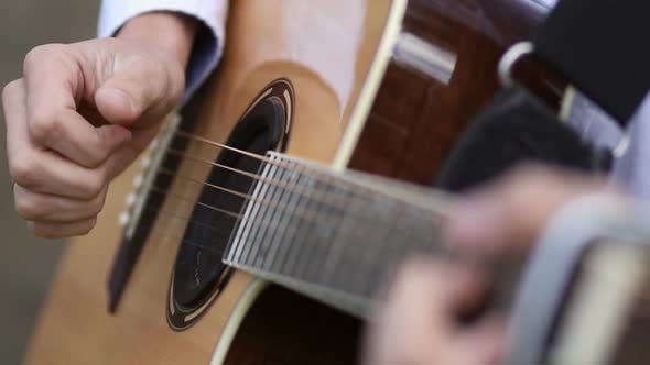 The Musician Plays the Guitar During a Live Performance