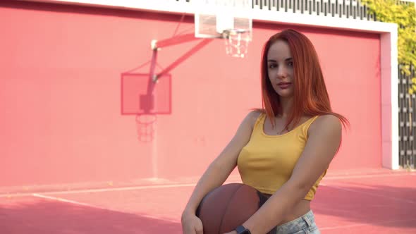 Sporty Sexy Woman Student with Basketball