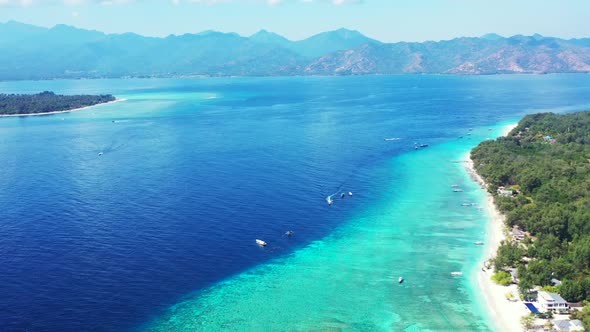 Aerial drone shot nature of tranquil coast beach lifestyle by clear sea with white sand background o