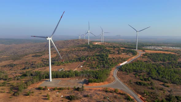 Aerial Shot of a Group of Wind Turbines in a Semidesert Environment