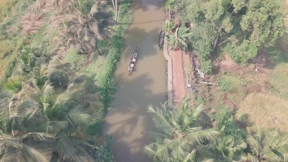 Boat trip of Kerala backwaters at Alleppey, India. Top down aerial drone view