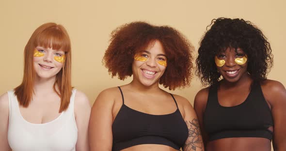 Girl Friends of Different Races Pose with Eye Patches