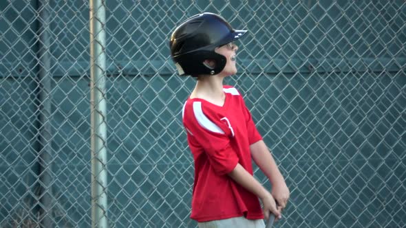 Boys practice for a little league baseball game.