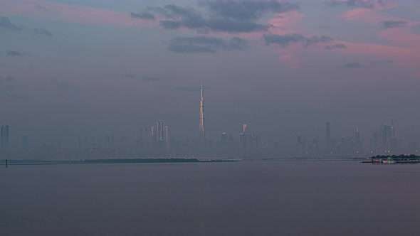 View of Burj Khalifa Skyline From the Dubai Creek Harbour Sunset Timelapse.