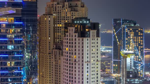 Aerial View of Modern Skyscrapers and Beach at Jumeirah Beach Residence JBR Night Timelapse in Dubai