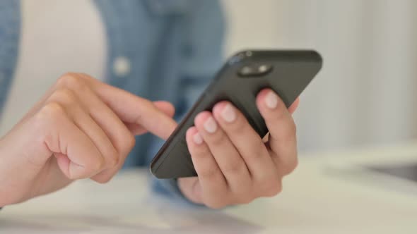 Close Up of Hands of African Woman Using Smartphone