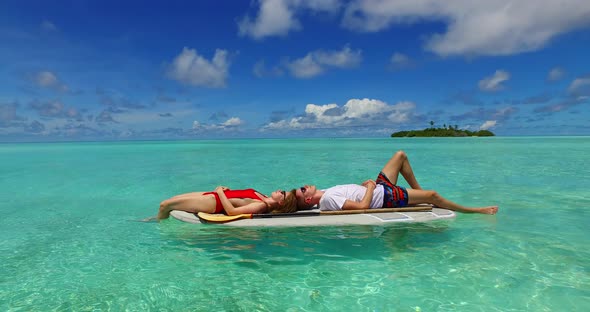 Happy boy and girl on honeymoon vacation spend quality time on beach on white sand background 