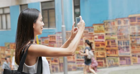 Woman taking selfie in Hong Kong famous landmark