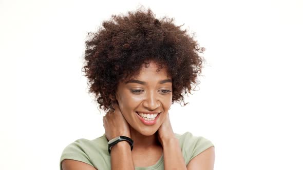 Surprised Young Beautiful African Girl Laughing Over White Background