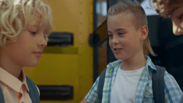 Three Teen Children Standing at Open Bus Door Closeup