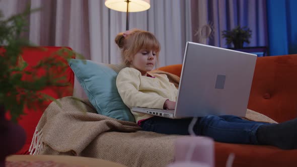 Little School Kid Girl Use Laptop Computer Learning Reading Online Education Lessons Alone at Home