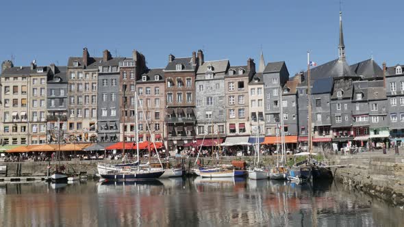 HONFLEUR, FRANCE - SEPTEMBER 2016 Famous  architecture reflections on water of northern Normandy The