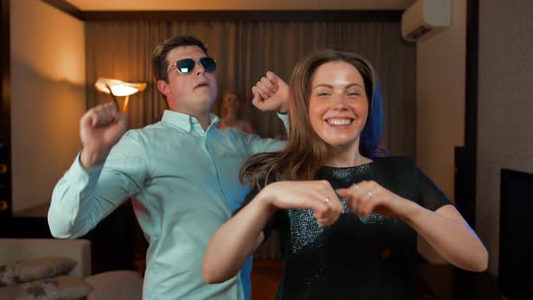 Couple Have Funny Dance at Evening Party