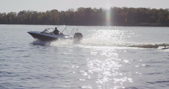 Man Driving a Speedboat