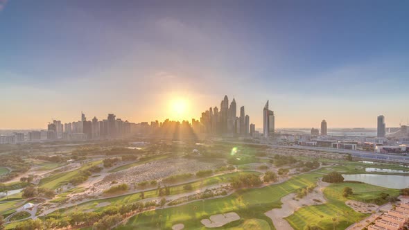 Dubai Marina Skyscrapers and Golf Course Sunset Timelapse Dubai United Arab Emirates