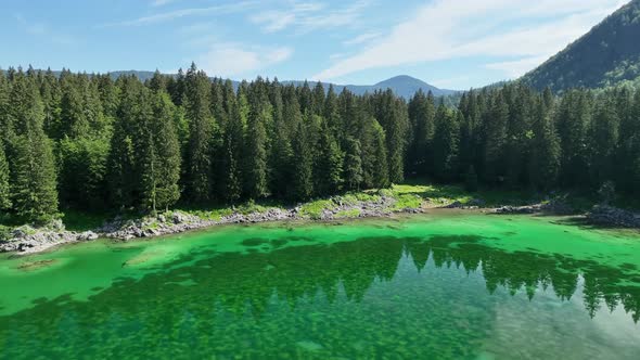 Emerald lake at Fusine with Mangart mountain