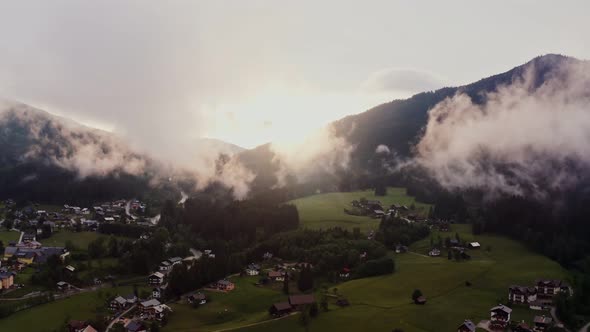 Panoramic View of a Picturesque Mountain Valley with a Village in a Lowland