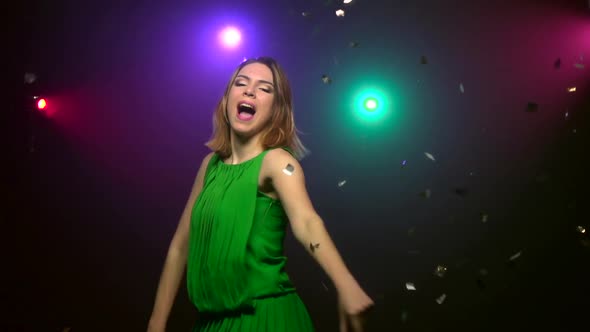 Dancing of Woman in Green Dress. Close-up. Slow Motion