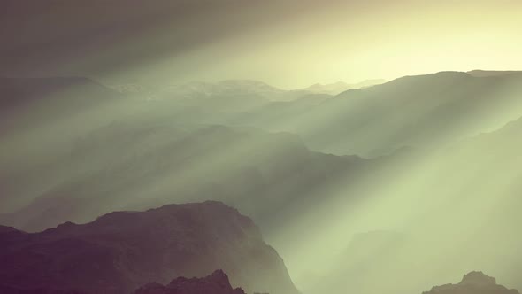 Black Rocky Mountain Silhouette in Deep Fog